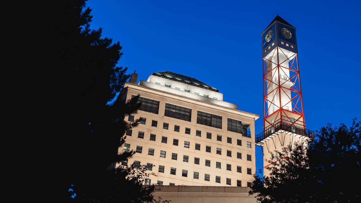 The Civic Centre clock tower lit pink, blue and white.